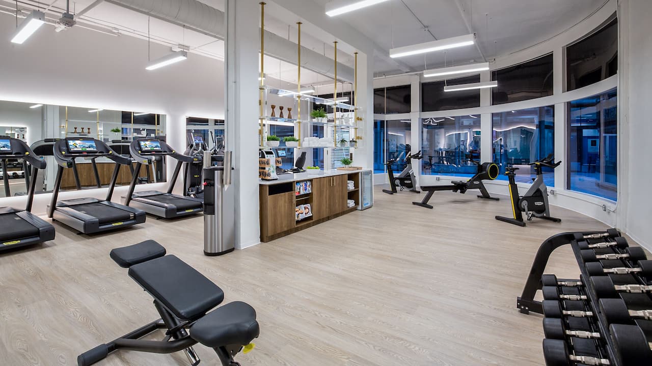 Fitness Center with cardio equipment and free weights 