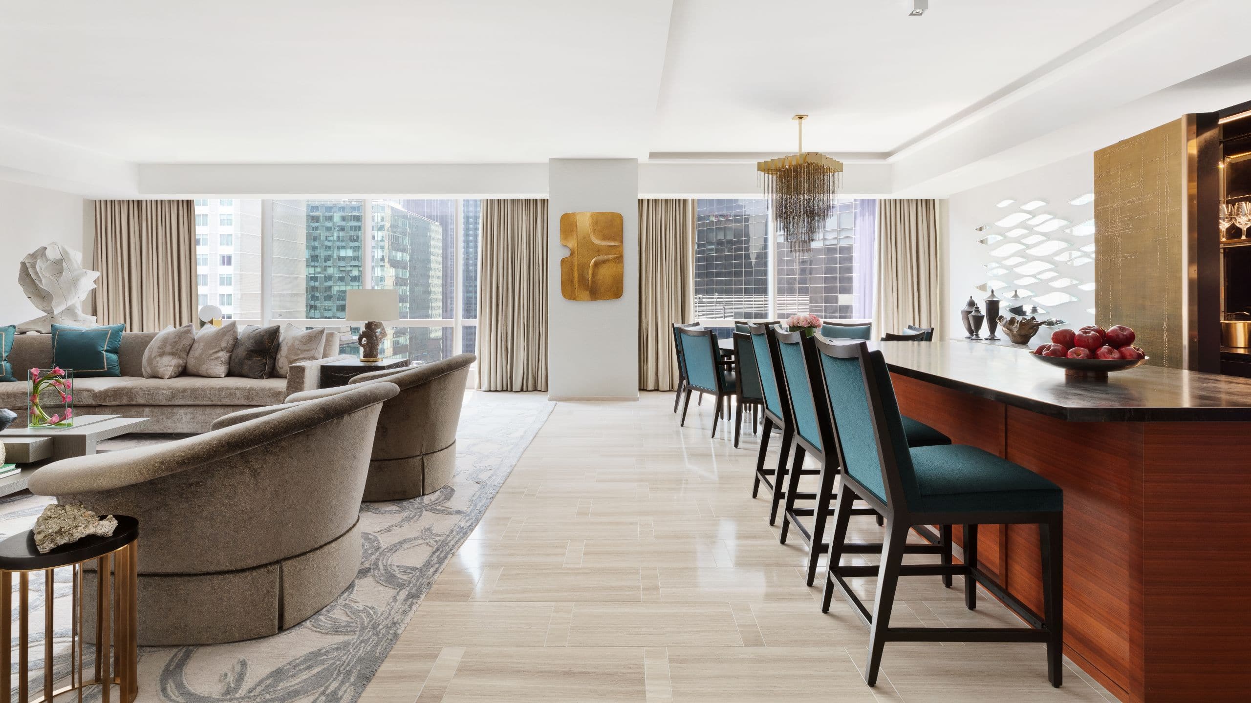 4 of 8 The bar area, windows, dining area, and seating in the living area of the Royal Suite