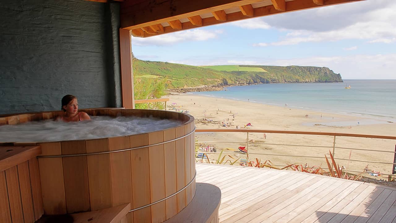 Sheltered outdoor hot tub has commanding views over Carne 