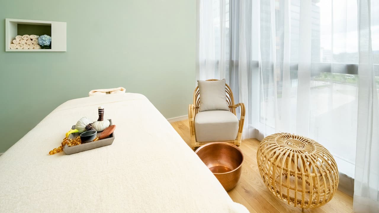 Zaitania Spa treatment room with massage table in a soothing atmosphere 