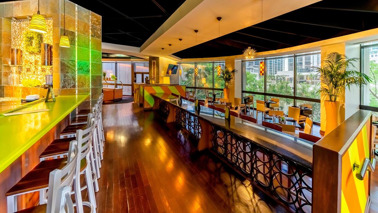 Riverview Bar and Grill dining area with floor-to-ceiling windows