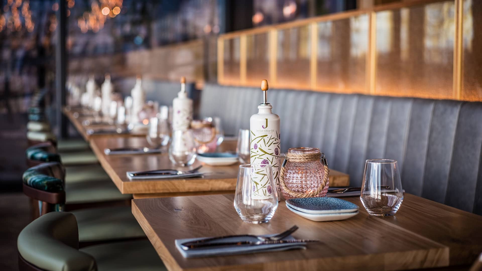 Tables in an evening atmosphere at Grissini Restaurant of Hyatt Regency Cologne