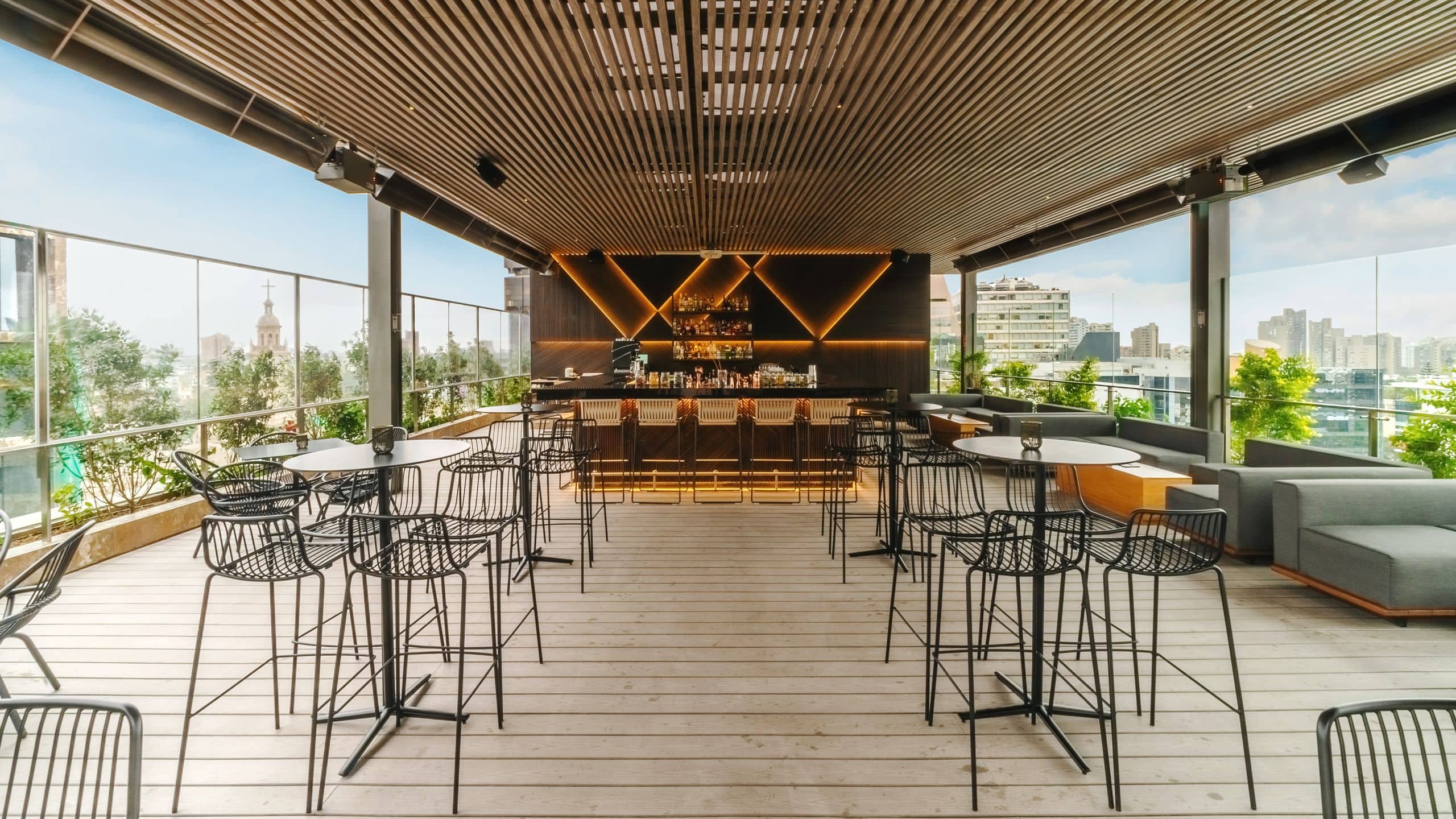 Celeste Solar Bar located on the rooftop with open air seating, high top tables, bar seating and couches