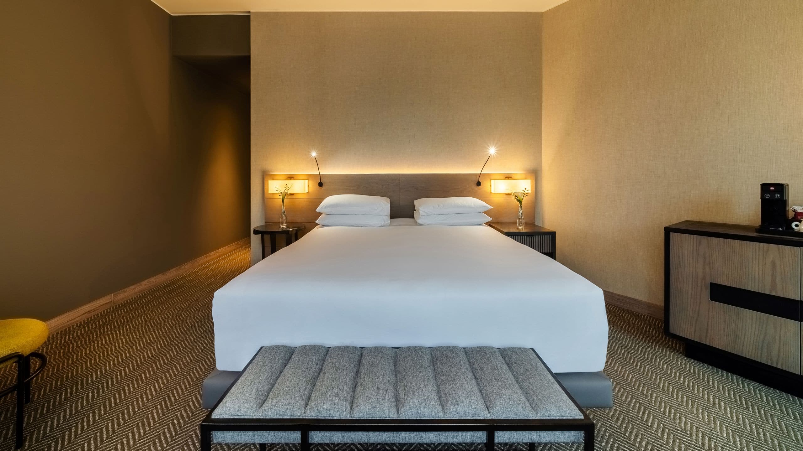 Junior Suite with King Bed, bedroom bench and two side tables