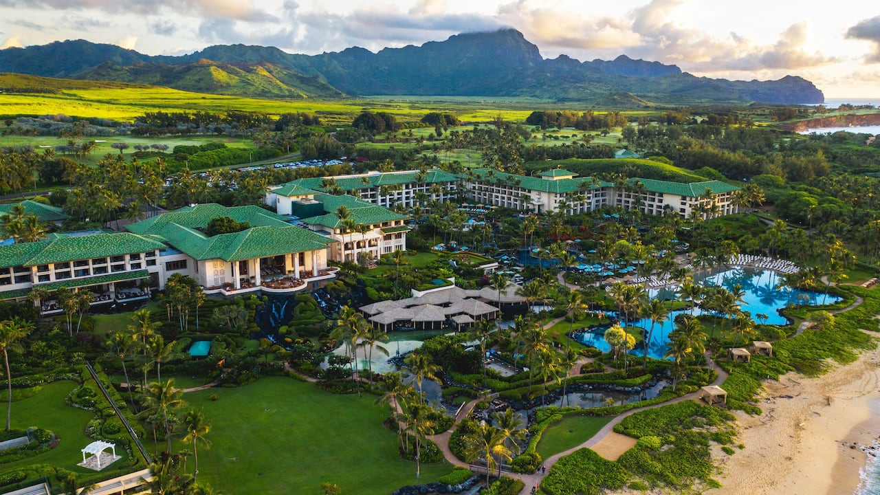 Hotel resort view with mountains in the background of Grand Hyatt Kauai Resort and Spa