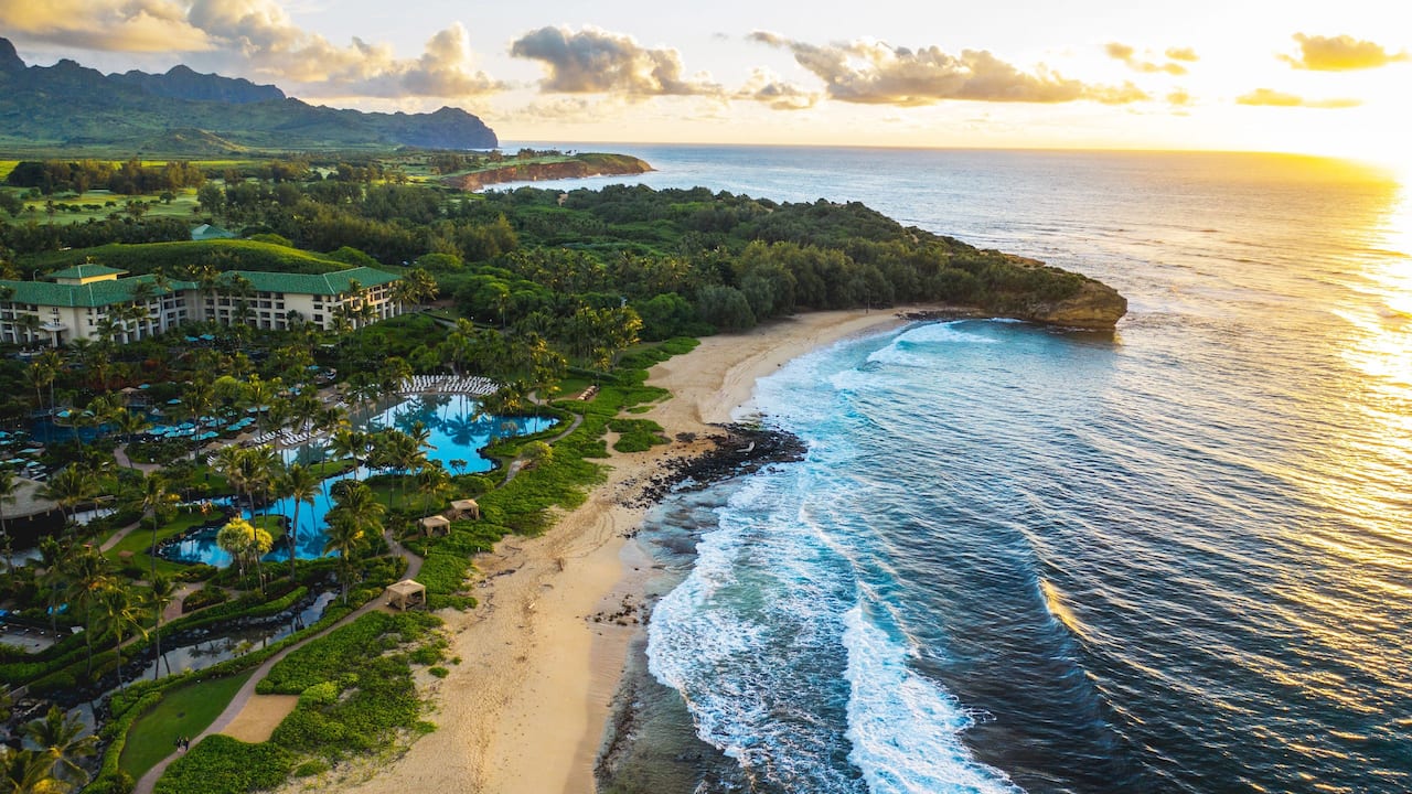 Coastal view of the hotel, pools, beach and ocean at Grand Hyatt Kauai Resort and Spa