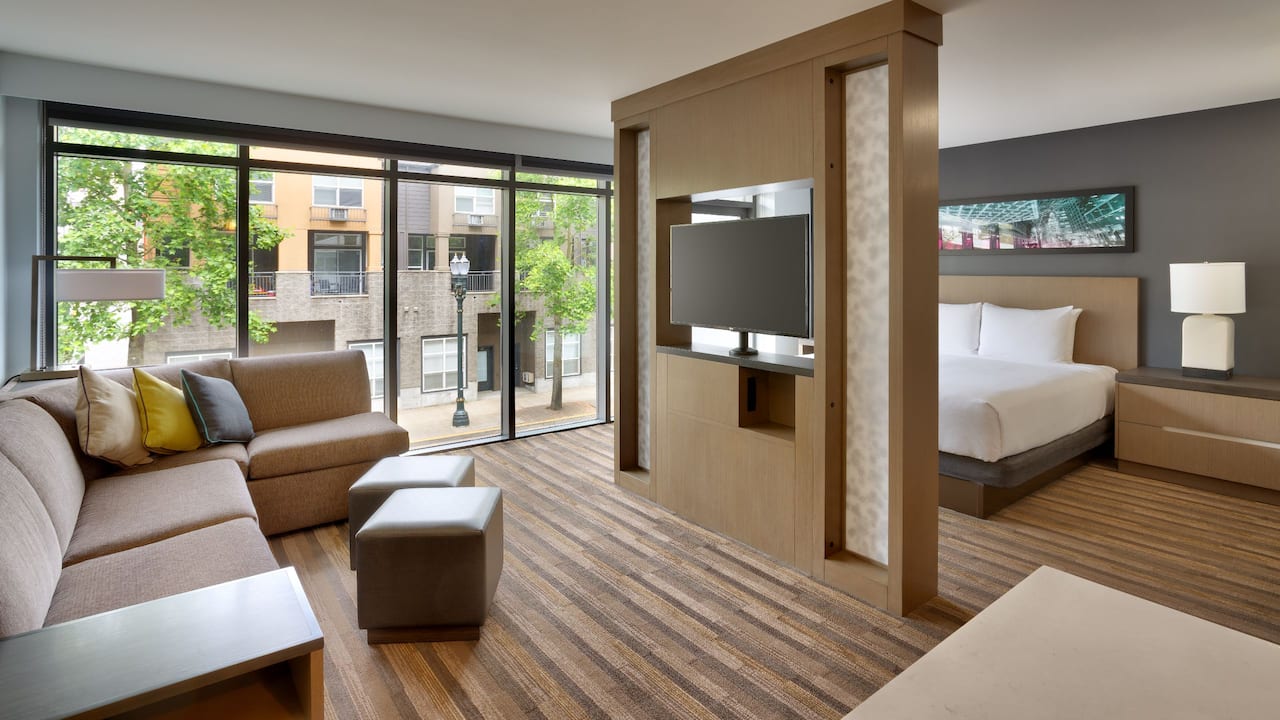 Specialty Studio Kitchen Suite living area with floor-to-ceiling windows 