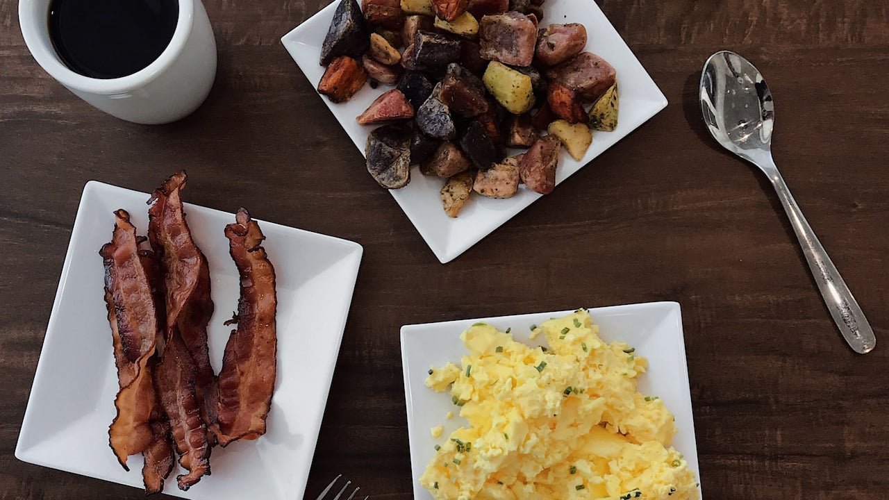 Breakfast Bar scrambled eggs, bacon, potatoes and coffee 