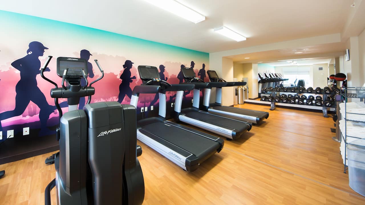 Fitness Center with cardio equipment and free weights