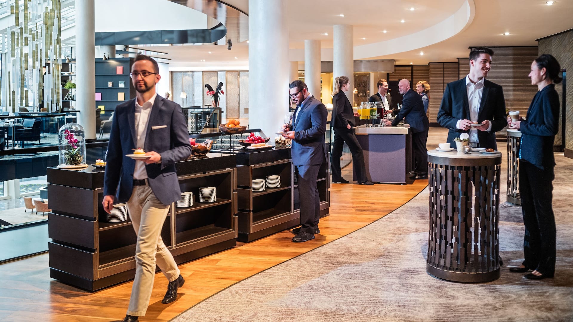 Meeting participants serve themselves at the buffet during coffee break at Hyatt Regency Cologne