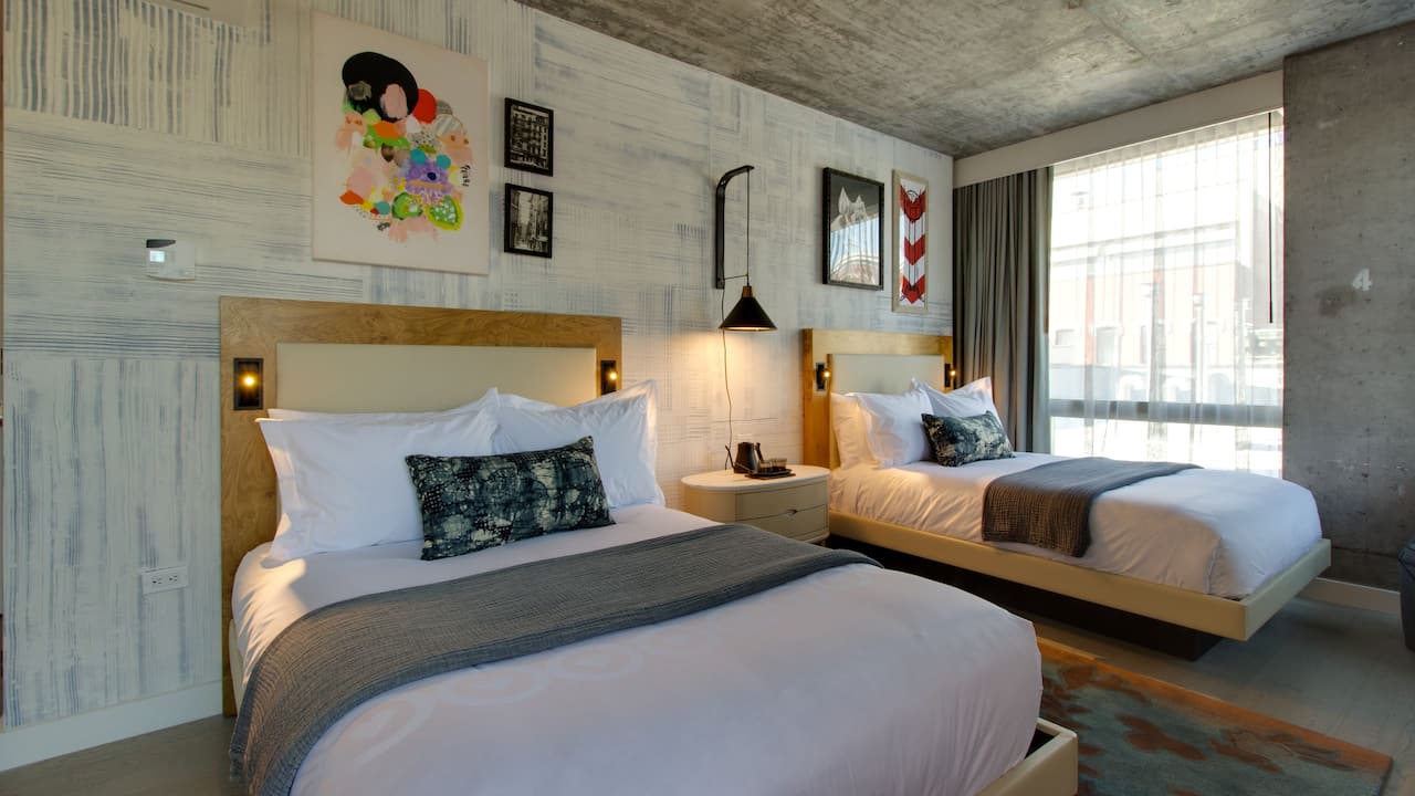 Deluxe Double Guest Room with modern decor and artwork