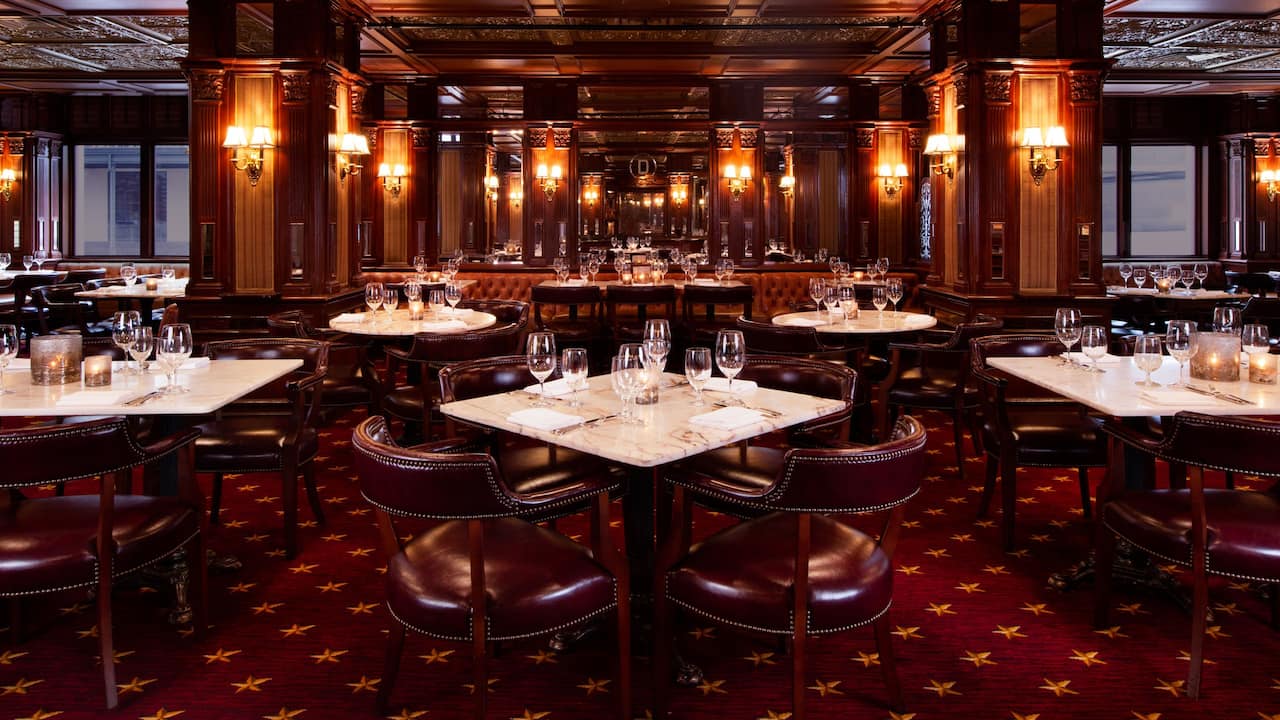 Grill Restaurant dining room with elegant tables and leather chairs