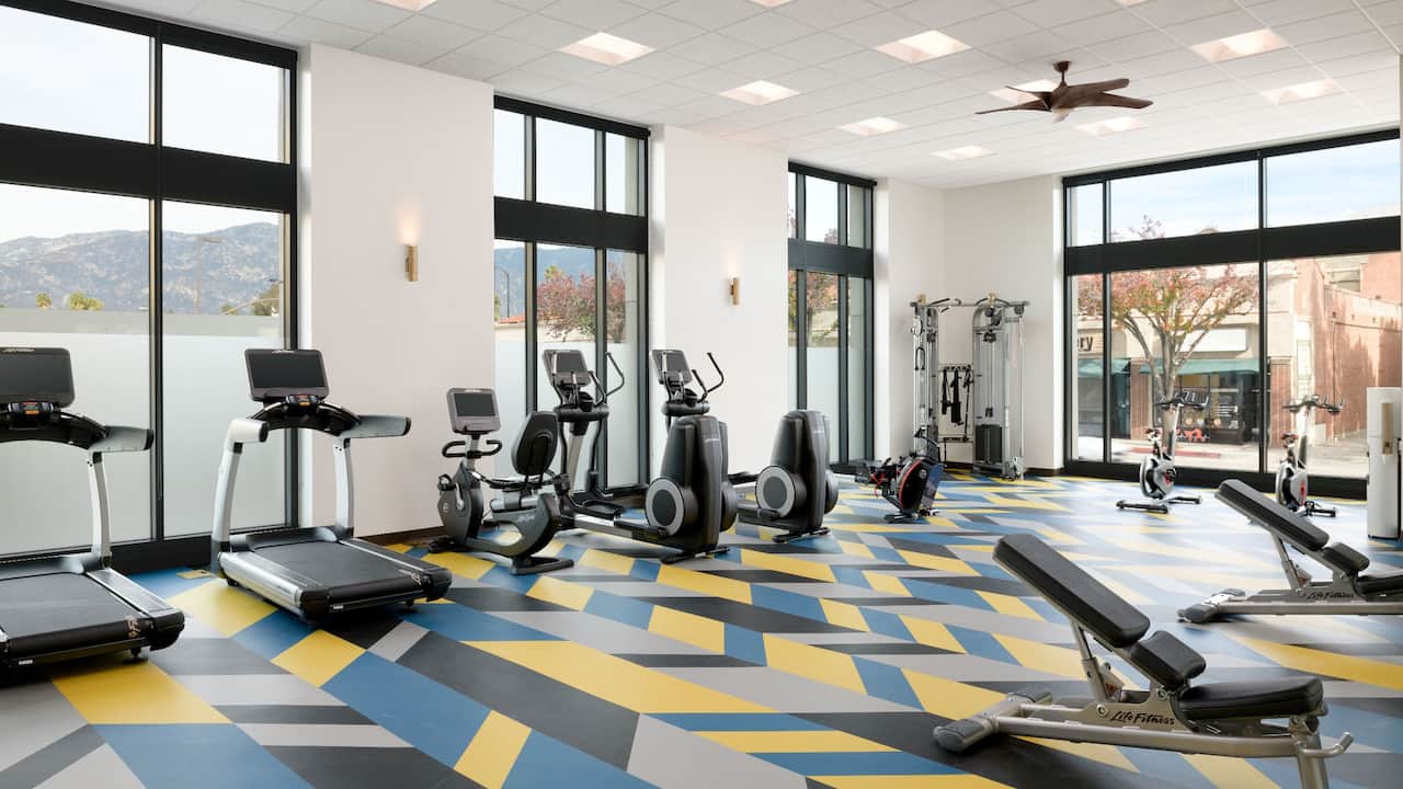 Fitness Center with cardio equipment and large windows