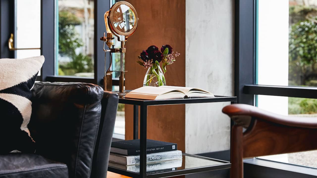Lobby reading area details with magnifying glass and books
