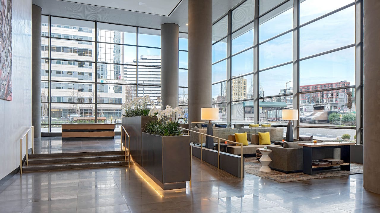 Lobby with floor-to-ceiling windows overlooking the city