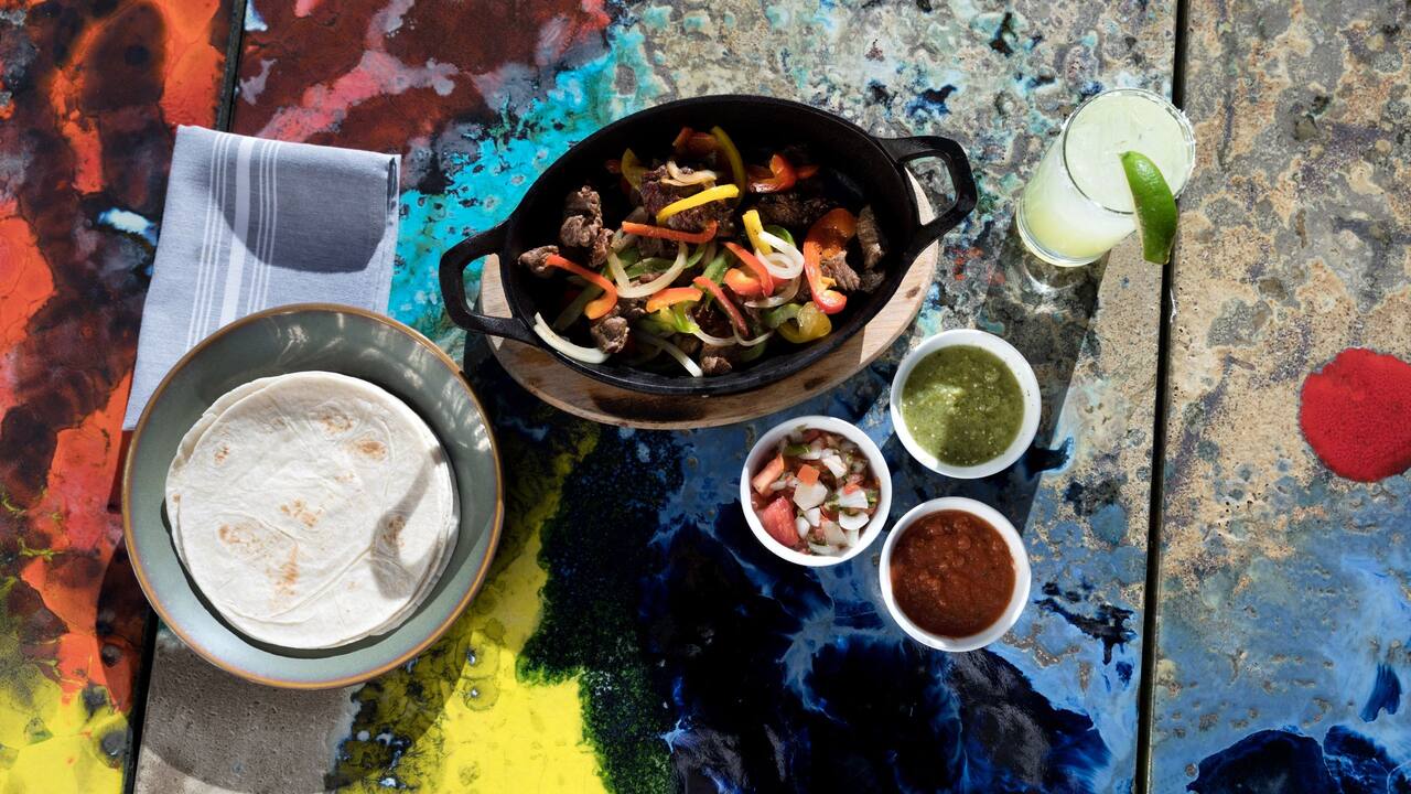 Fajitas and a beverage served at a Downtown Austin hotel