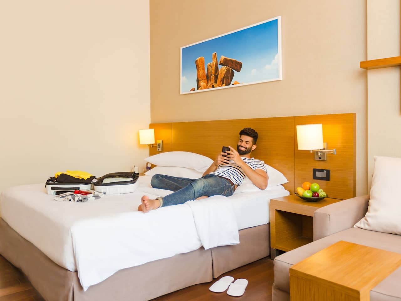 Man Relaxing in Room at Hyatt Place Hampi