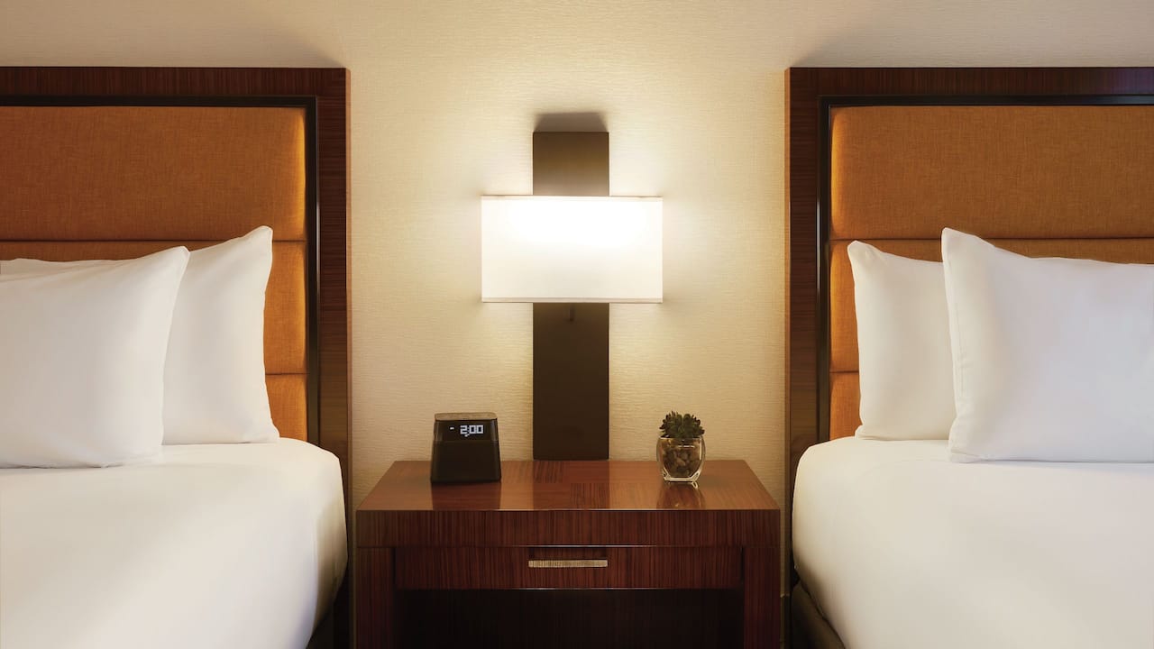 An ADA compliant hotel room with two queen beds and an accessible shower in downtown Phoenix