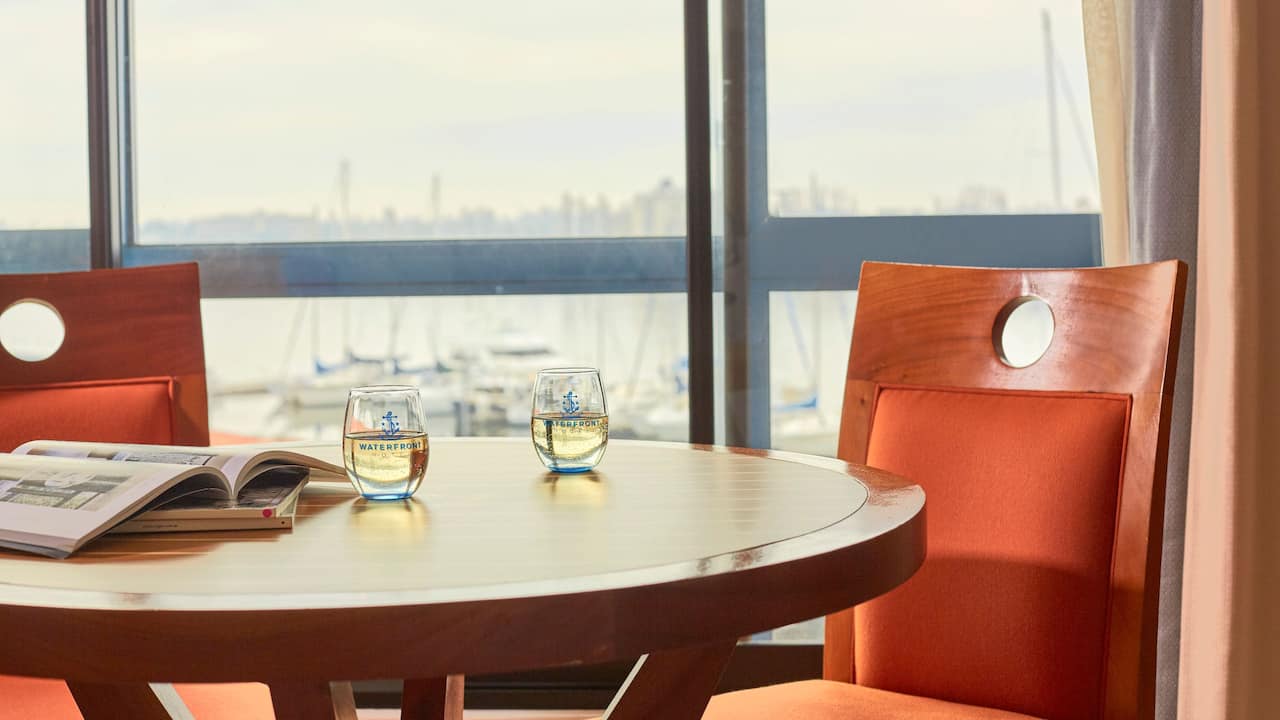 Waterfront restaurant dining table and harbor view