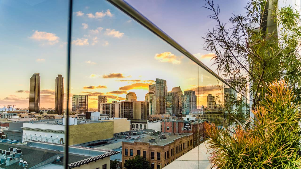 Hotel rooftop city view during sunset