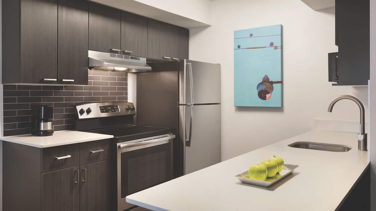 One-bedroom double suite kitchen area with fridge and full oven and stove at Hyatt House Boston / Burlington