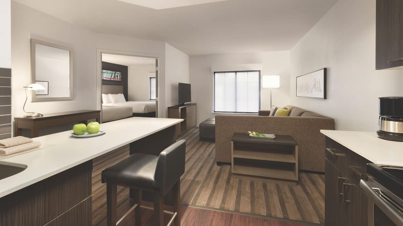 One-bedroom double suite living area couch and kitchen counter at Hyatt House Boston / Burlington