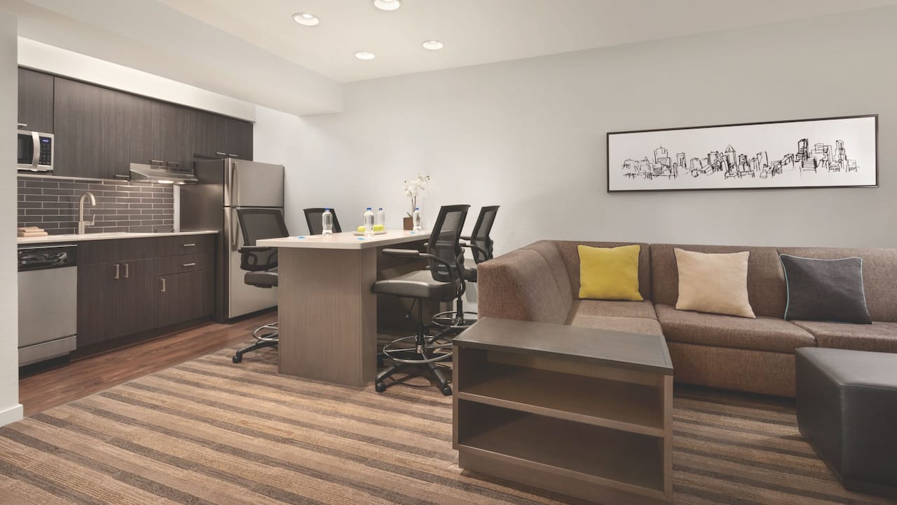 One bedroom king conference suite table, kitchenette and living room sofa at Hyatt House Boston / Burlington