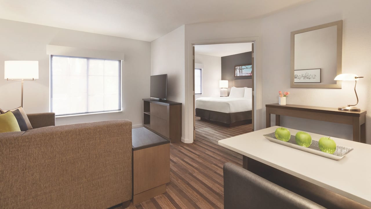 Accessible queen suite with door open to bedroom at Hyatt House Boston / Burlington