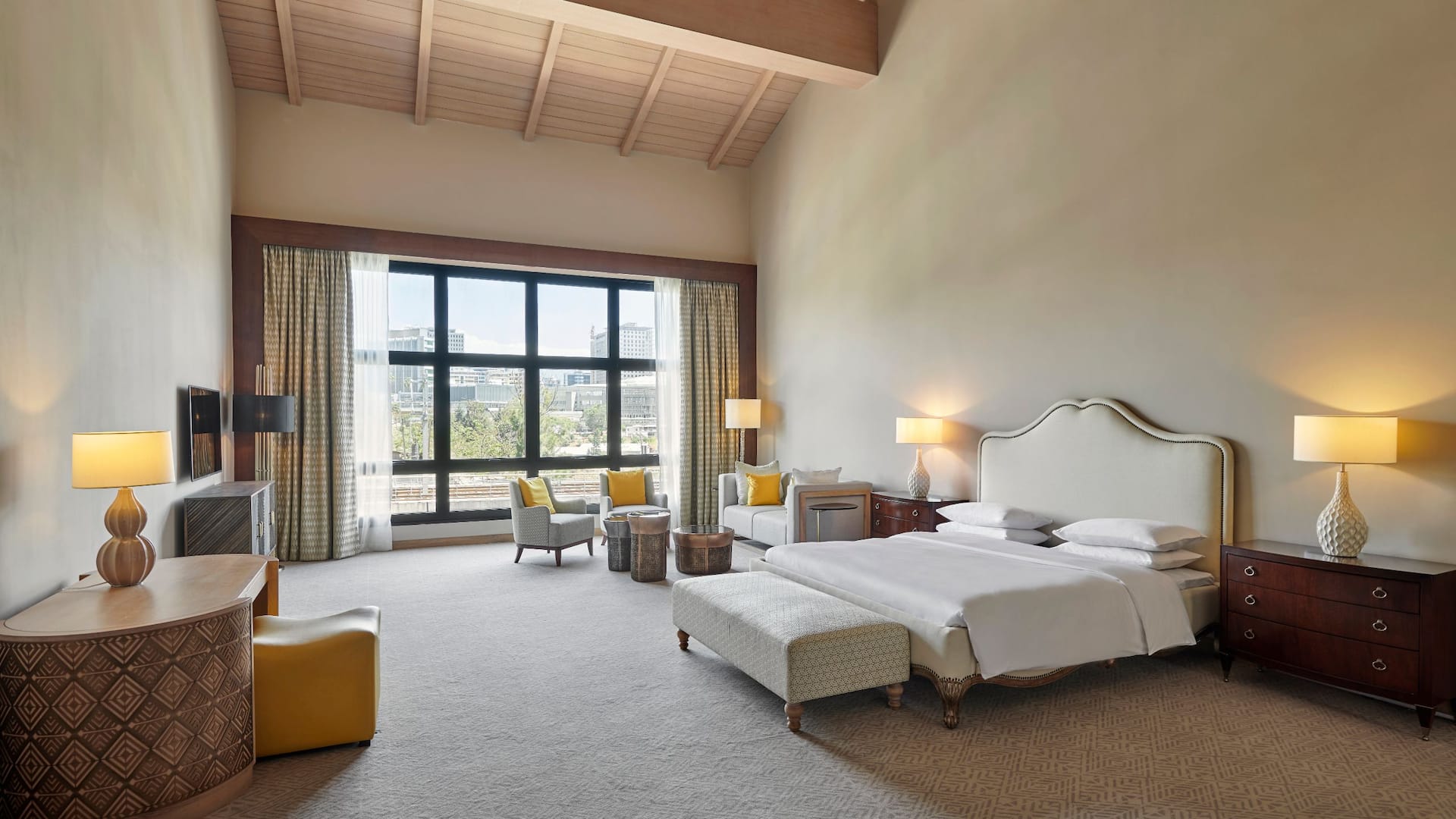 Luxurious bedroom in the Ababal Suite at Hyatt Regency Addis Ababa, featuring elegant decor and stunning views