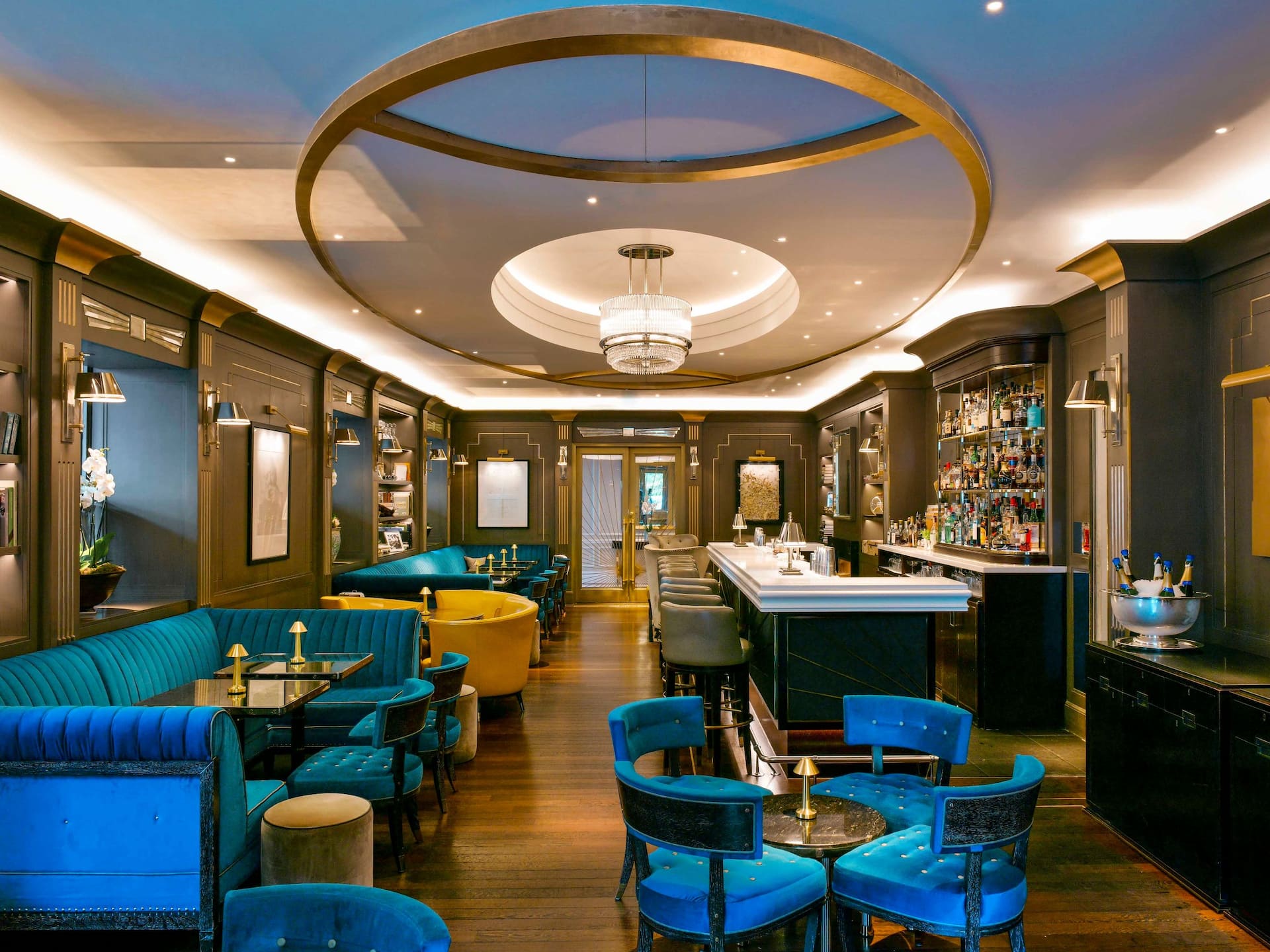 Churchill Bar & Terrace interior showing the chic art-décor, warm lighting, captivating tones and complete bar set-up.