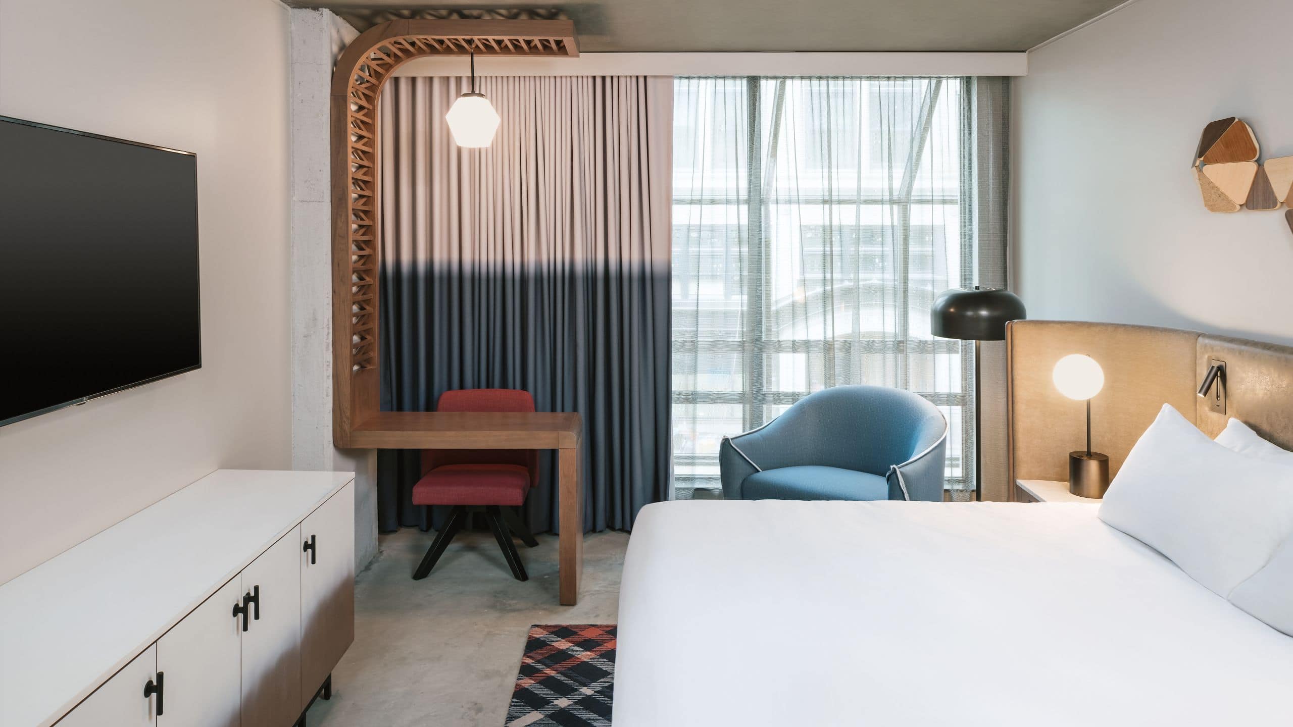 King Bed guestroom with work area and floor-to-ceiling windows