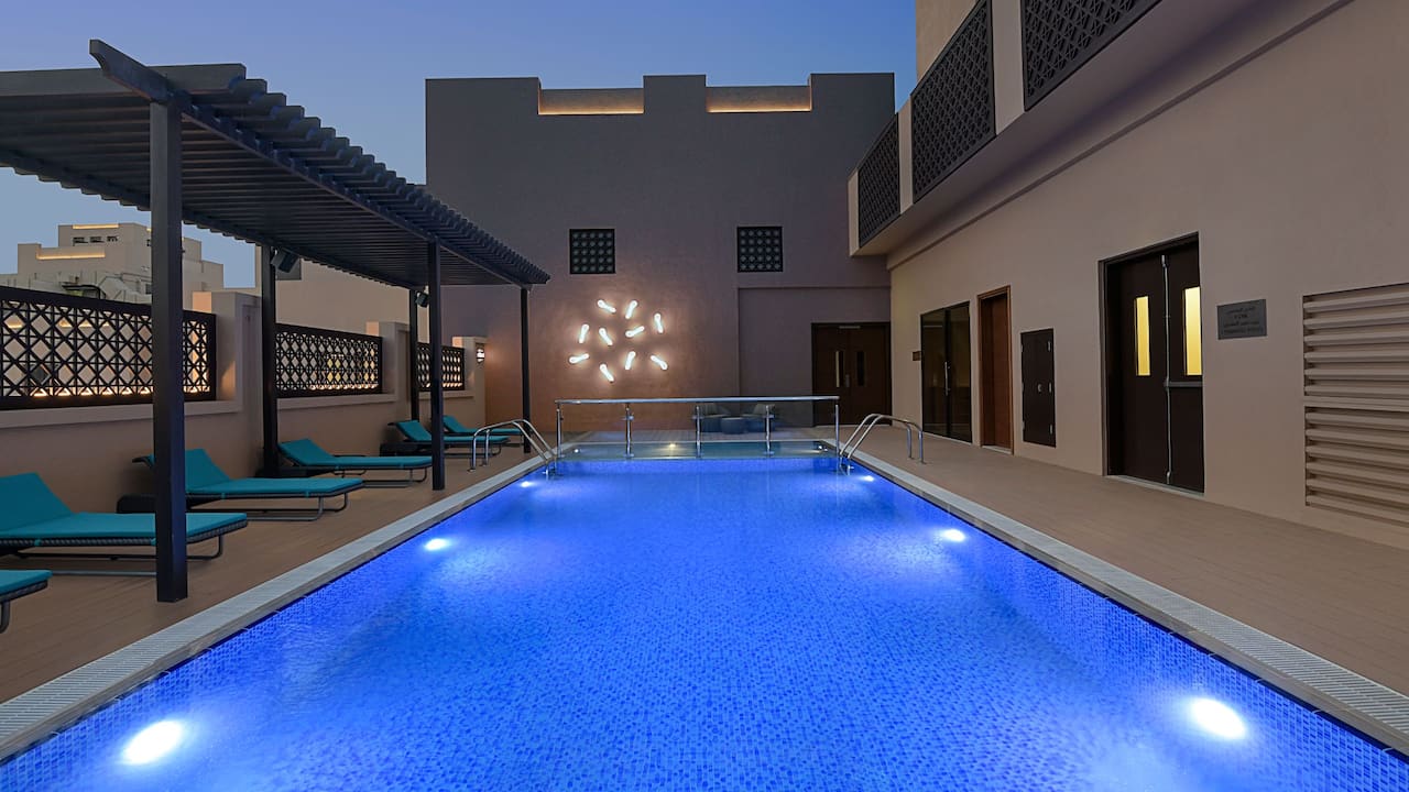 Rooftop swimming pool at night 