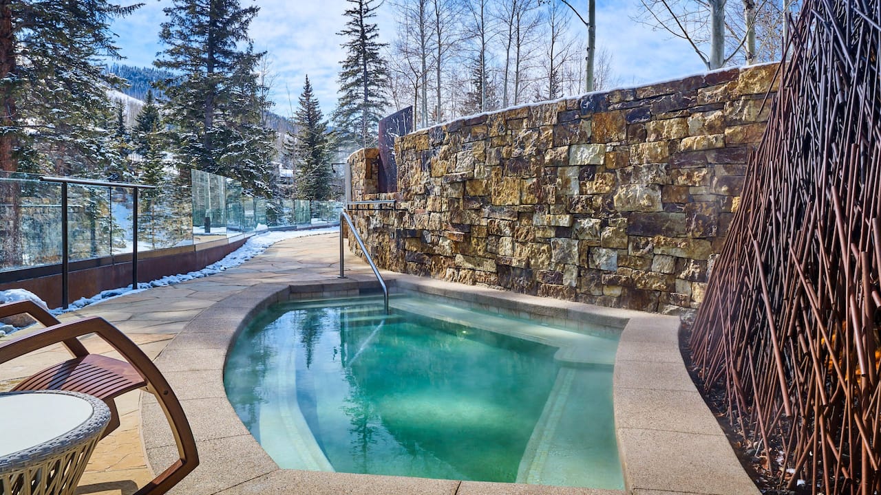 Outdoor hot tub with with decorative walls