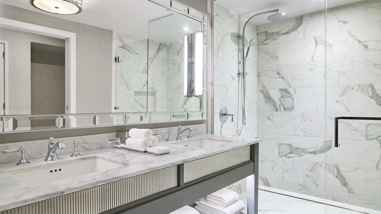 Guest bathroom with double vanity and walk-in shower