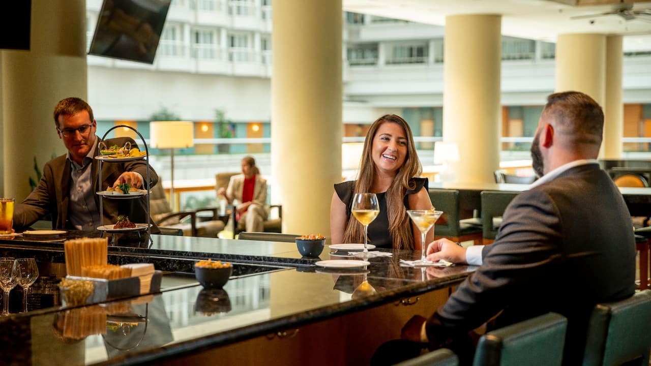 People having drinks at the lobby bar near the Orlando Airport
