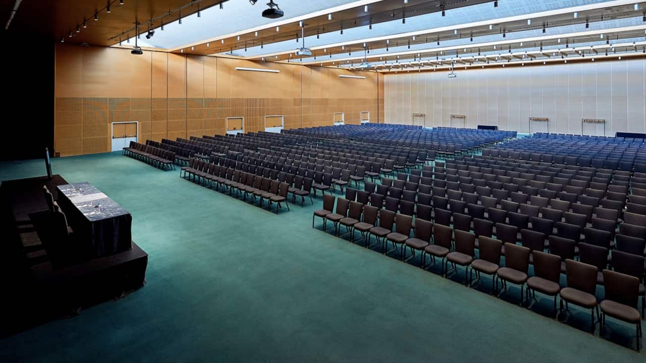 Large Cosmos ballroom with theater-style seating arrangement and a maximum capacity of 1800 attendees at our Hyatt Regency Barcelona Tower hotel.