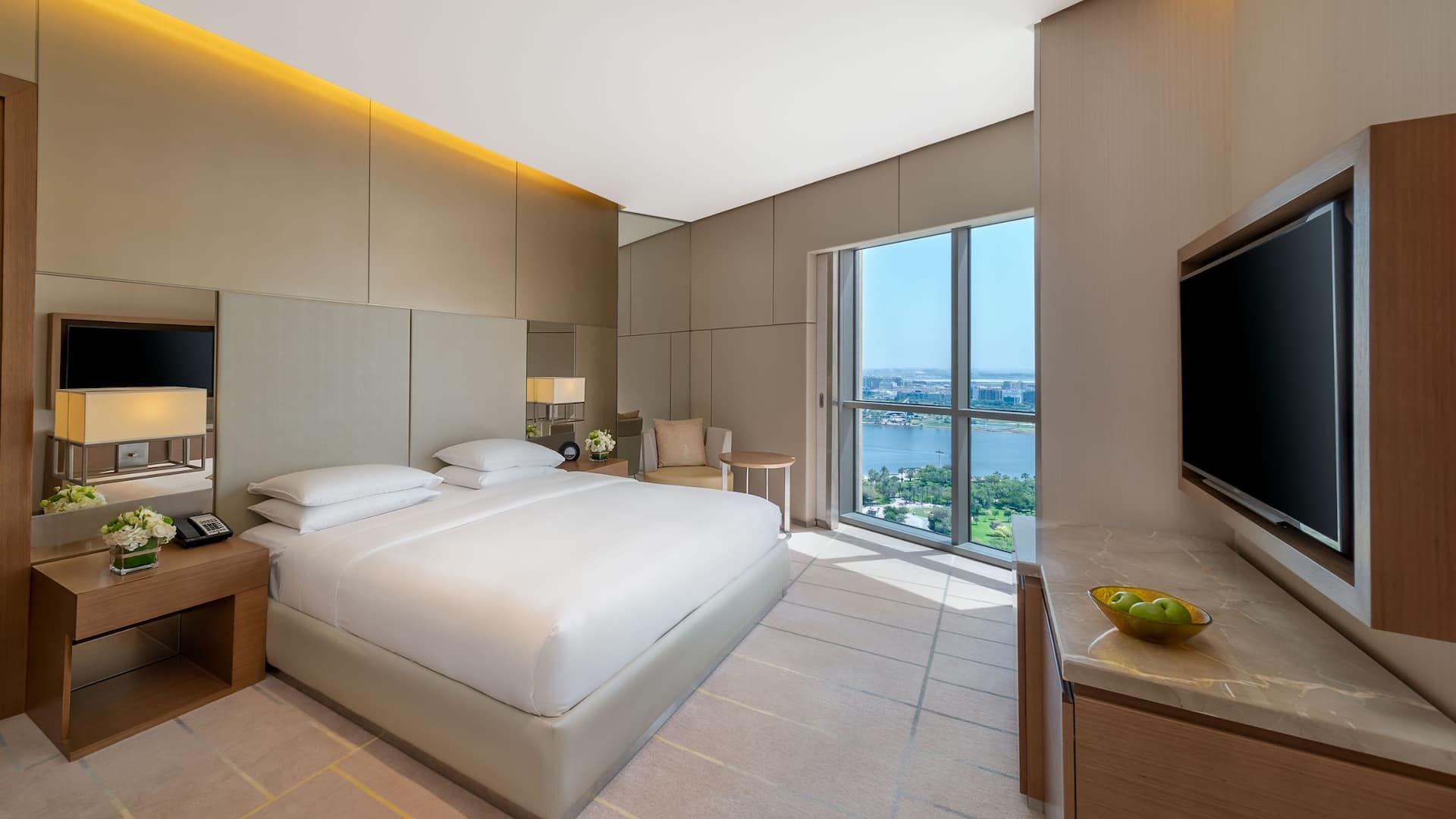 A room with one king bed and view of Dubai Creek.