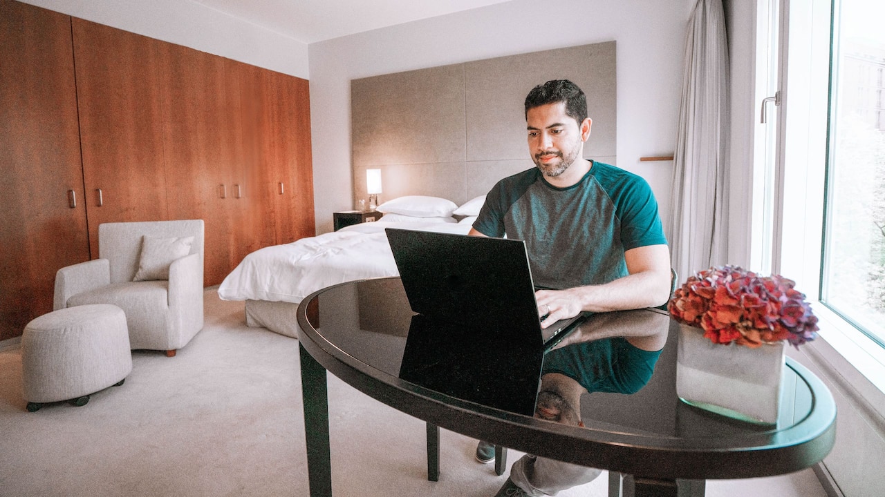 Grand Hyatt Berlin man working in suite