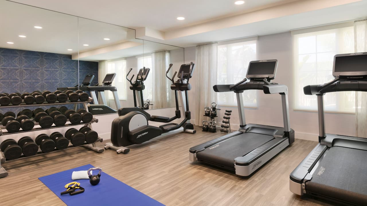 Fitness Center equipped with treadmills and free weights
