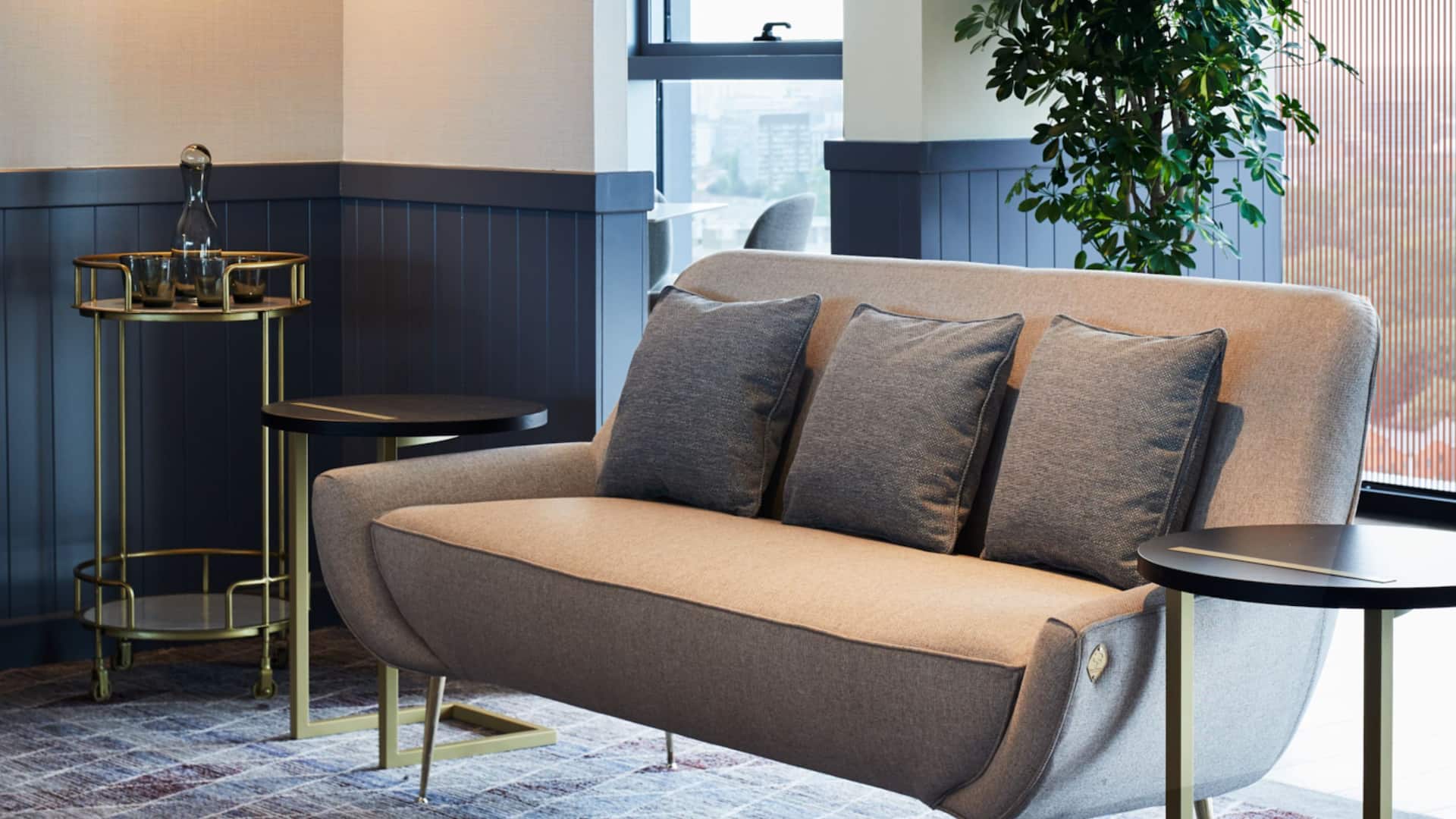 Hyatt House Manchester reception and lobby area with sofa