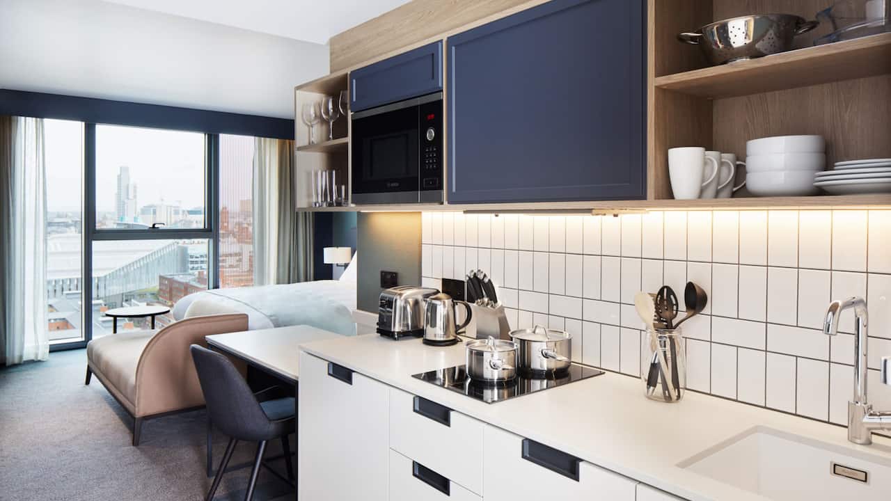 Standard Kitchenette with bedroom in the background