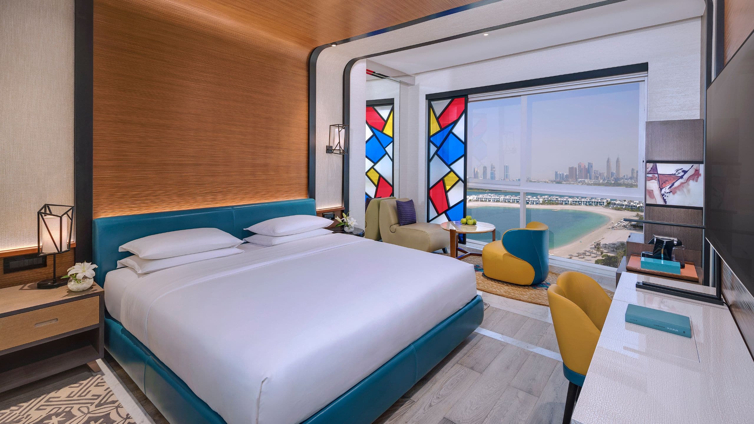 A room with king bed with panoramic view of the Arabian Gulf at Andaz Dubai The Palm.