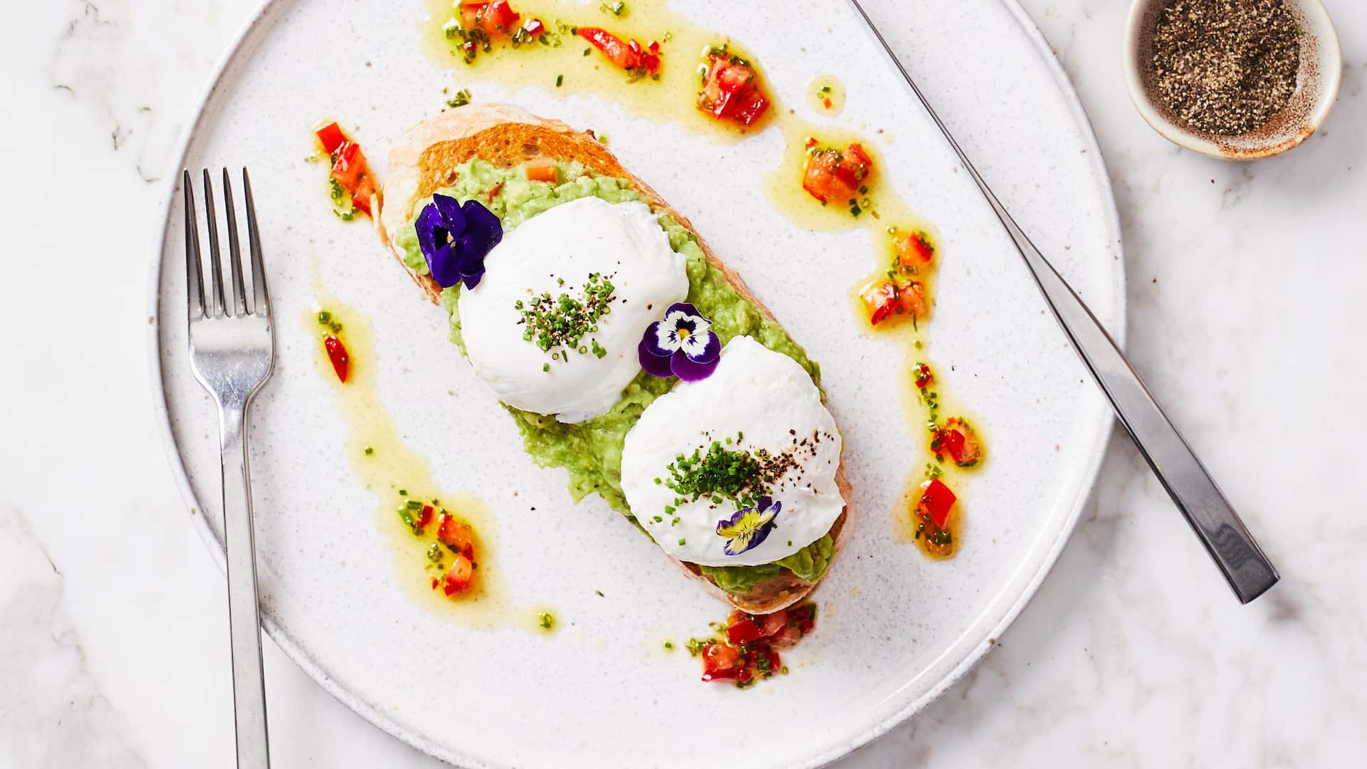 Poached eggs with colourful plate decor