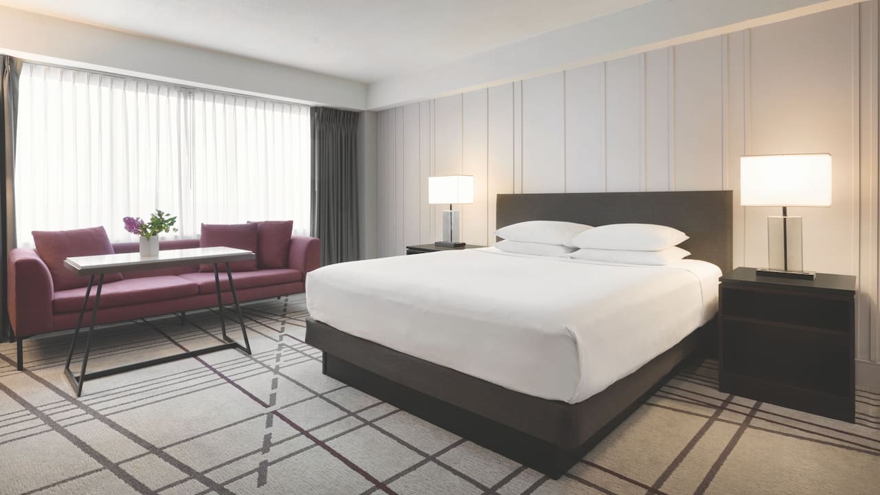 Hotel deluxe room with king bed at Hyatt Regency Louisville hotel in Kentucky