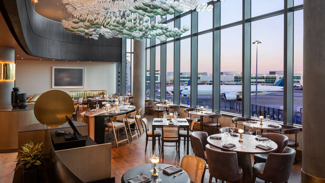 Quail + Crane dining room with airport view