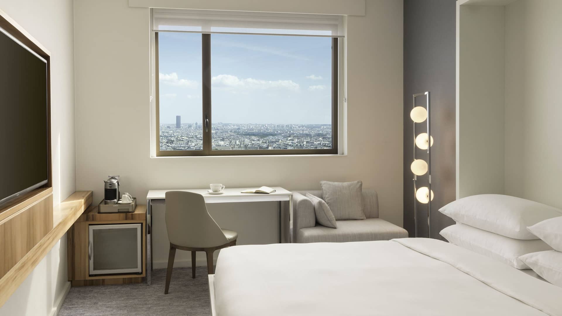 3 de 6 Hyatt Regency Paris Étoile Regency Suite Living Room Murphy Bed