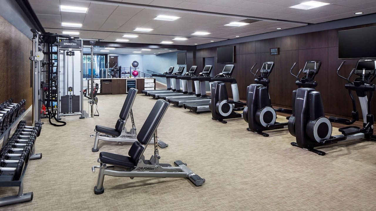 Fitness Center with cardio equipment and free weights 
