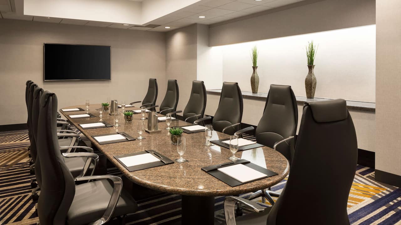 Boardroom with large table and tv