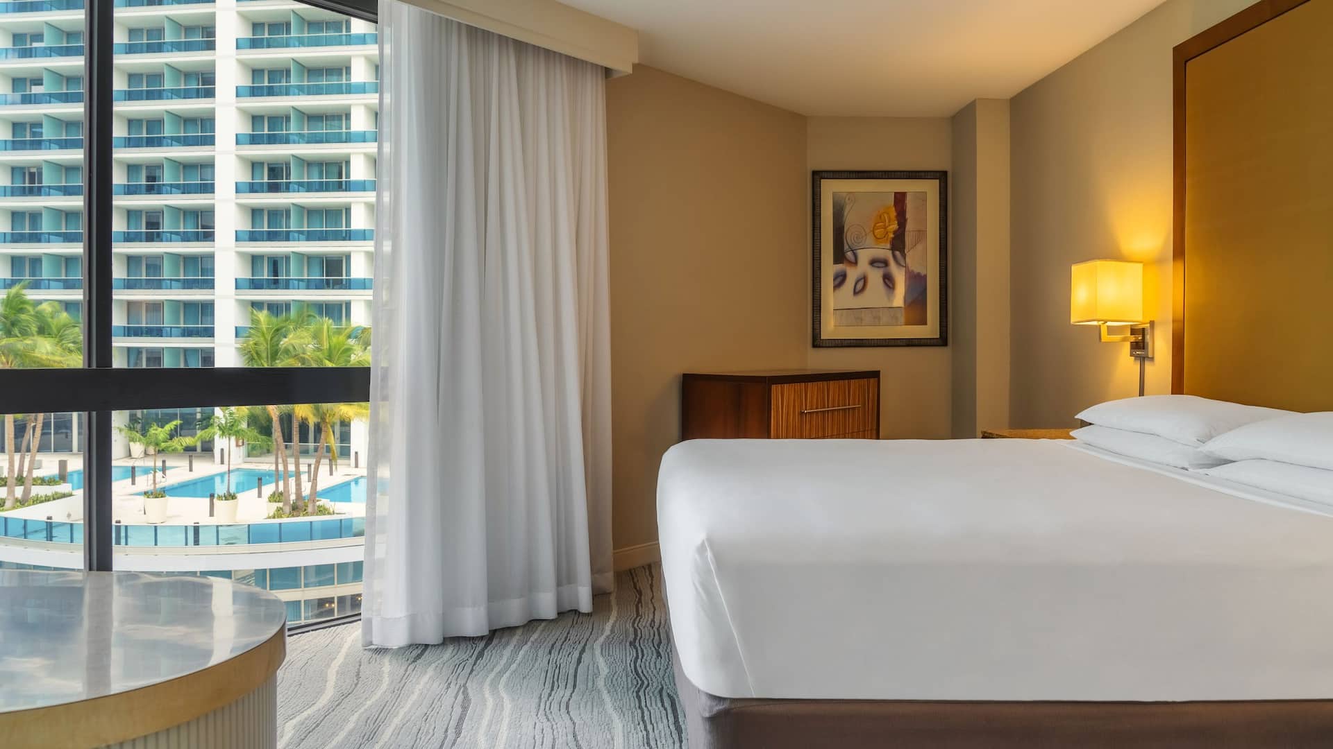 A downtown Miami hotel suite with a view of the rooftop pool