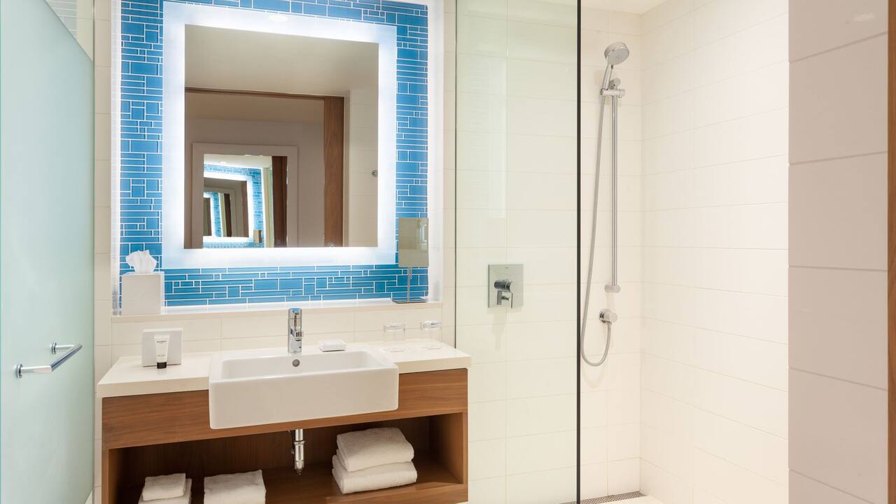 A brightly lit luxurious hotel resort suite bathroom in a Nassau Bahamas 